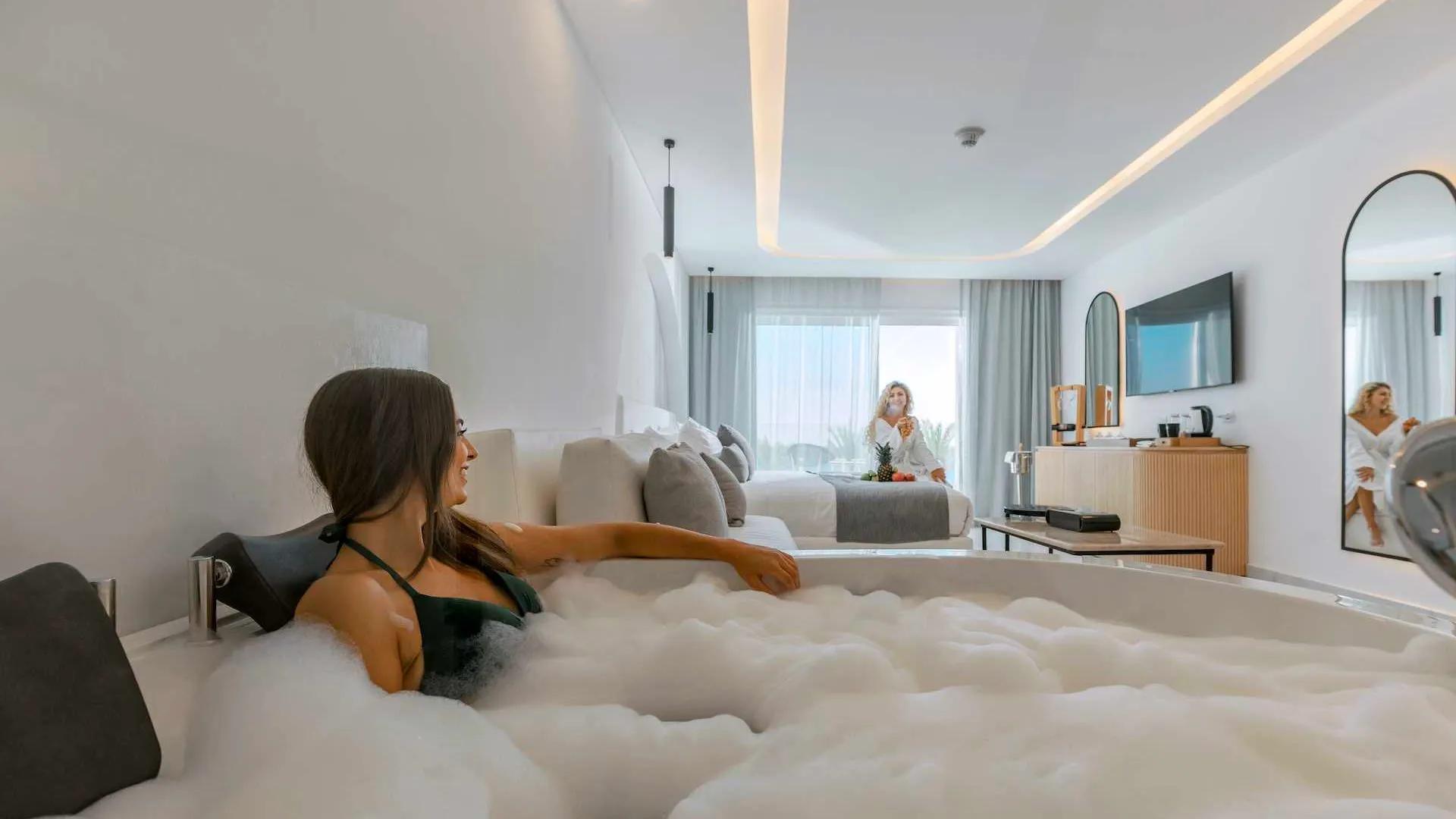 A Woman Sitting On A Bed