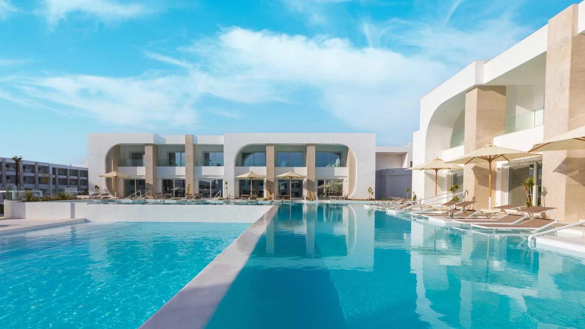A Swimming Pool In Front Of A Building