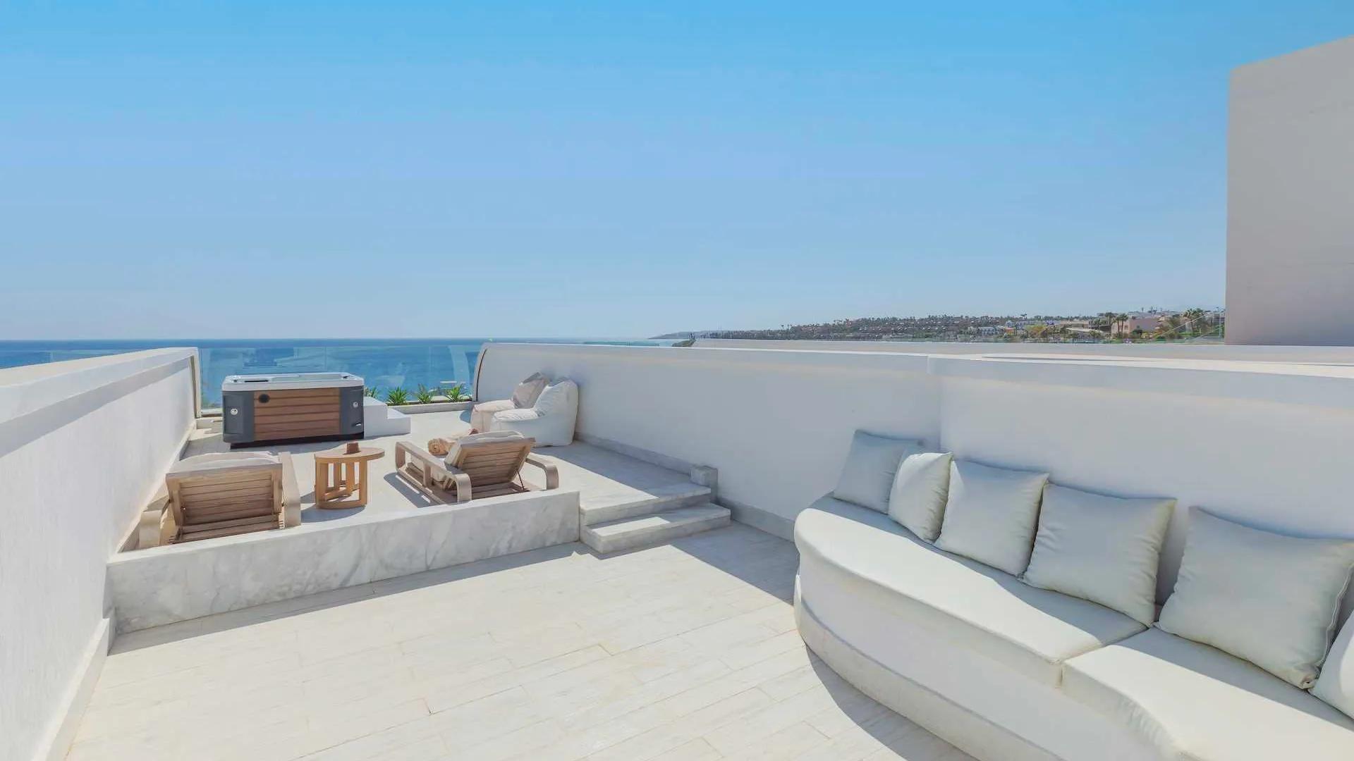 A White Couch On A Deck