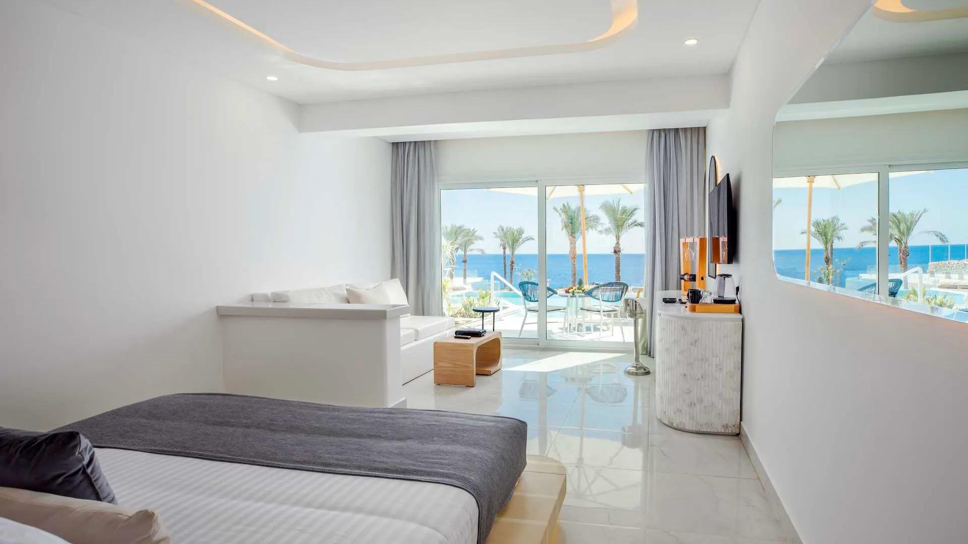 A Bedroom With A Large Window