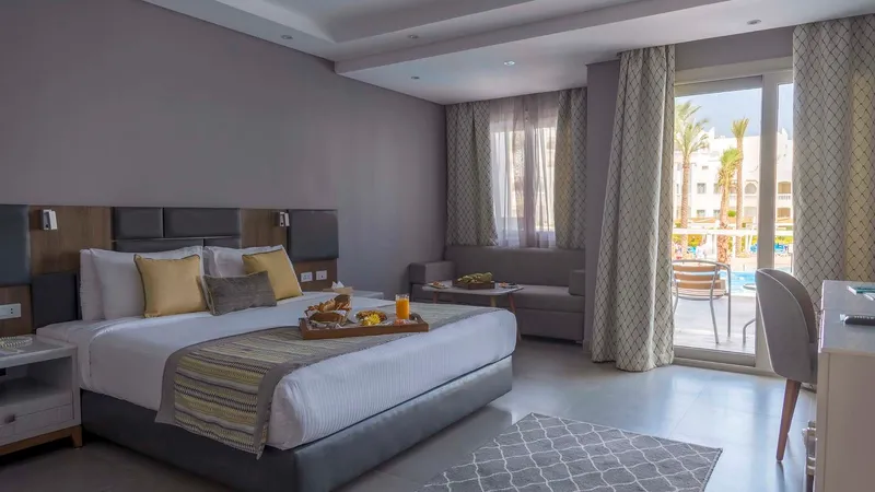 A Bedroom With A Large Bed