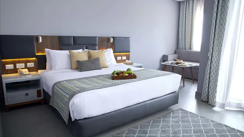 A Bed With A White Bed Spread