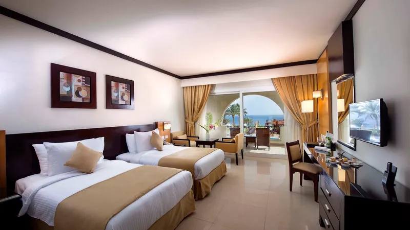 A Bedroom With A Large Window