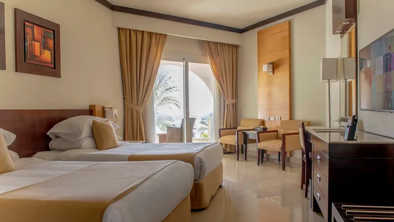 A Hotel Room With A Large Window