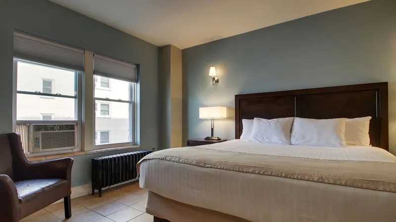 A Bedroom With A Large Bed In A Room