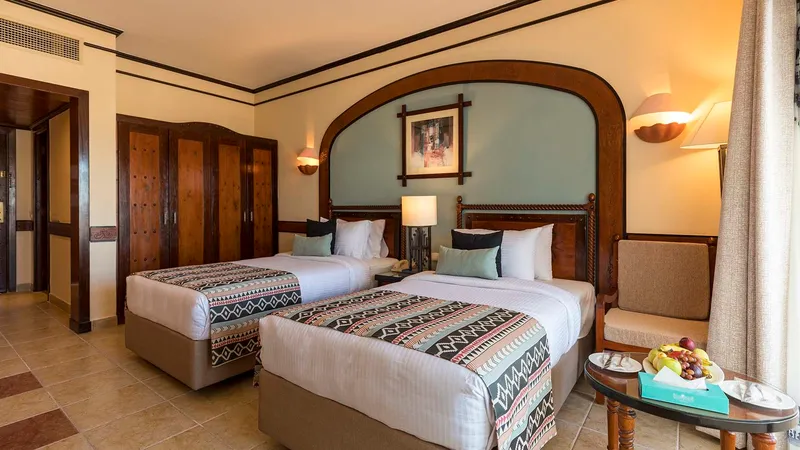 A Bedroom With Two Beds