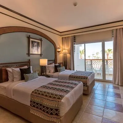 A Bedroom With Two Beds