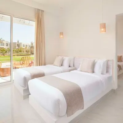 A Bedroom With A Large Window