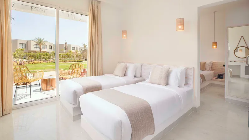 A Bedroom With A Large Window